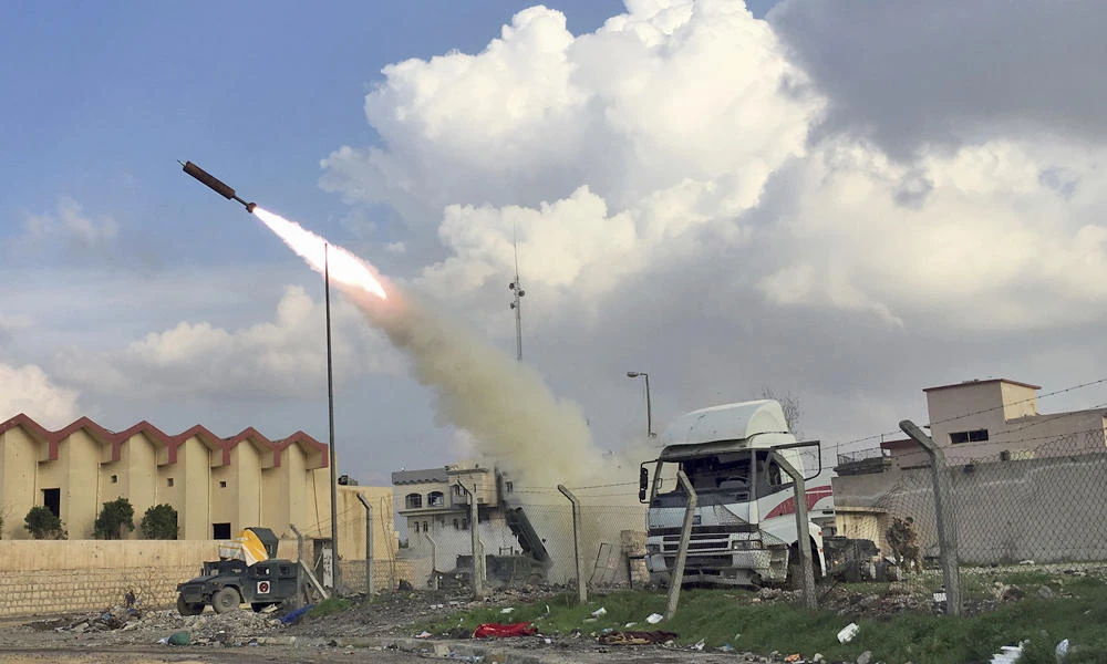 Iraqi security forces fire a rocket towards Daesh positions in Mosul, Iraq, on Monday. Iraqi forces are coming closer to recapturing the city of Mosul from the militant group. (AP Photo/Mohammed Numan)