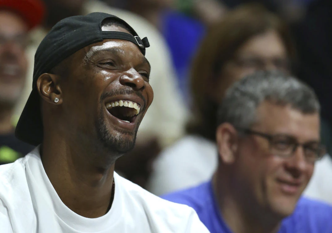 Miami Heat forward Chris Bosh smiles during the first half of an NCAA college basketball game between the Miami Hurricanes against the Duke Blue Devils at the Watsco Center in Coral Gables on Saturday, Feb 25. (AP)