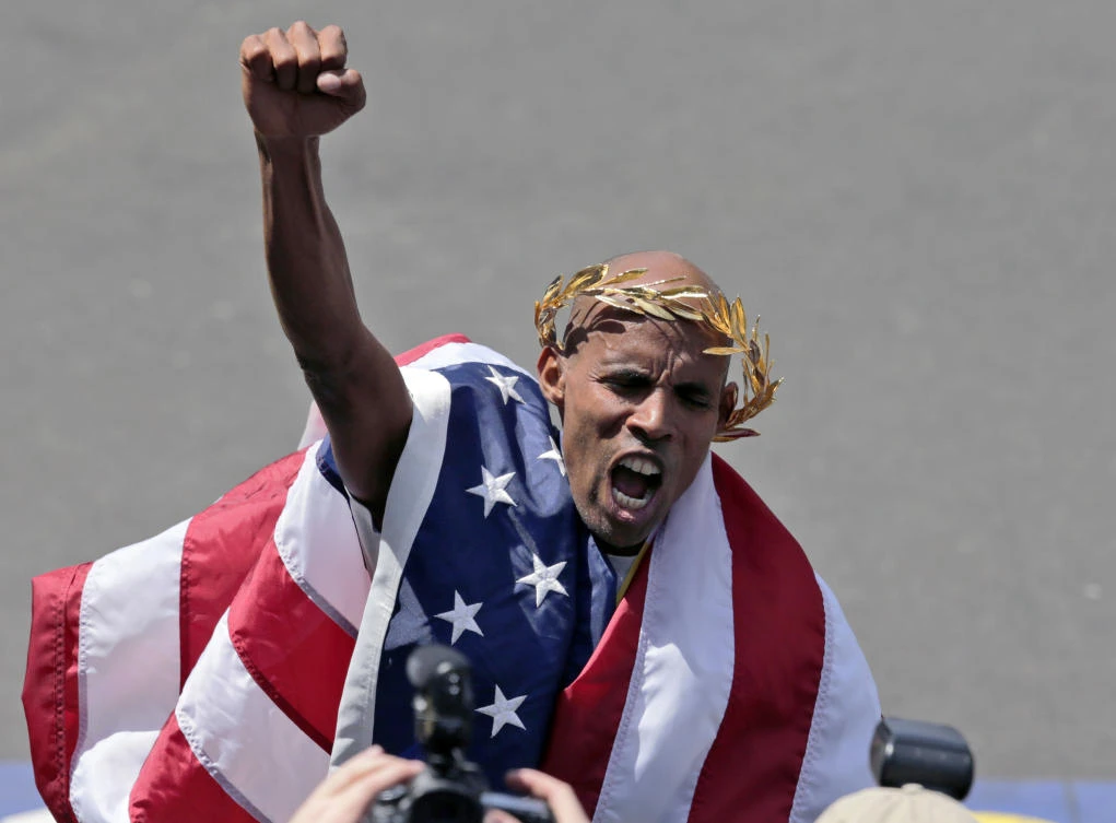 Meb Keflezighi celebrates his victory in the 118th Boston Marathon in Boston in this April 21, 2014, file photo. (AP)