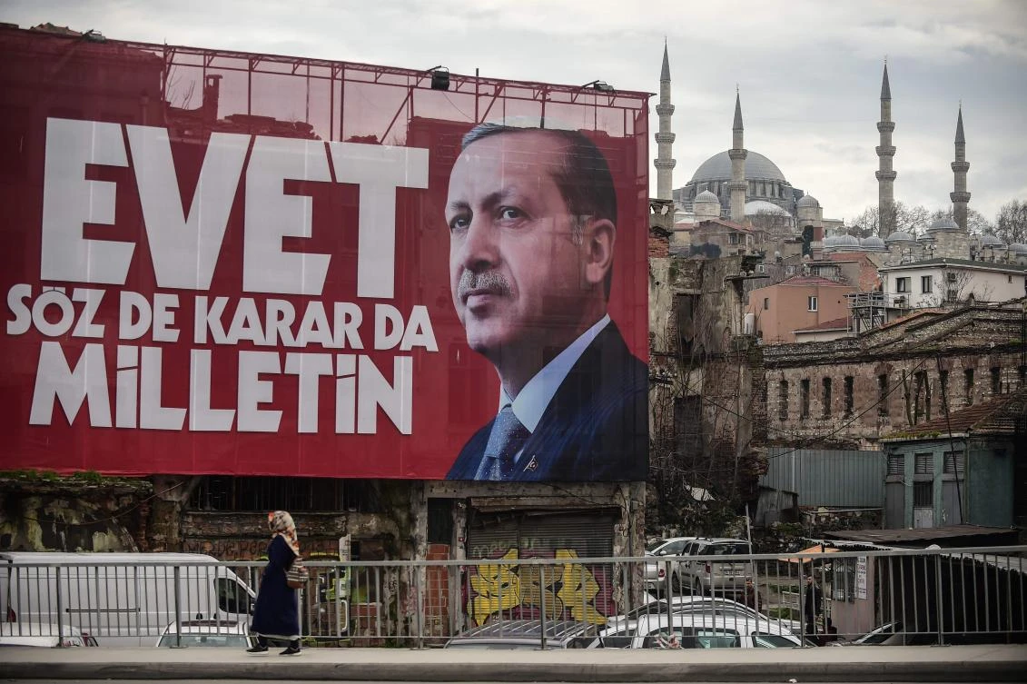 A poster of Turkish President Recep Tayyip Erdogan is seen with Suleymaniye mosque in the backround in Istanbul. (AFP)