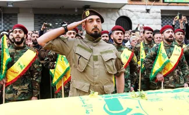Fighters of the Shiite Hezbollah movement attend the funeral of a comrade who died in combat in Syria during his funeral in the southern Lebanese town of Kfar Hatta, in this March 18, 2017 photo. (AFP)