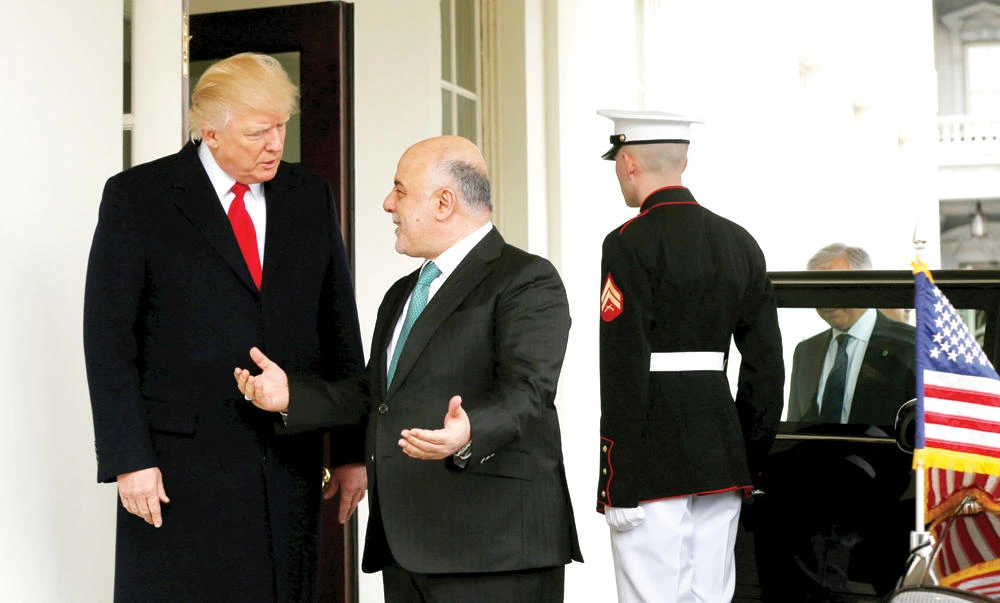 US President Donald Trump greets Iraqi Prime Minister Haider Al-Abadi at the White House in Washington. (Reuters)