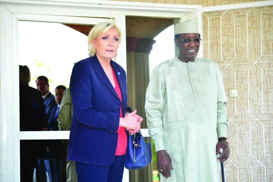 French populist leader Marine Le Pen poses with Chad’s President Idriss Deby Itno at the presidential palace in N’Djamena on Tuesday. (AFP)