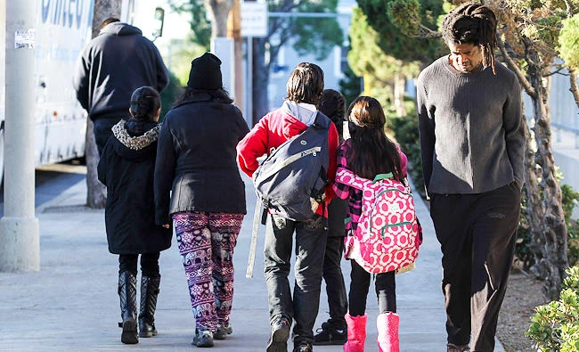 Parents take their children return home from school, in this Dec. 15, 2015 file photo, in Los Angeles. (AP)