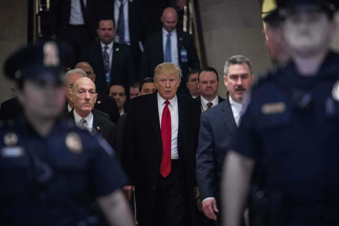 US President Donald Trump (C) arrives to meet with House Republicans about the new healthcare law at the US Capitol in Washington, DC. (AFP)