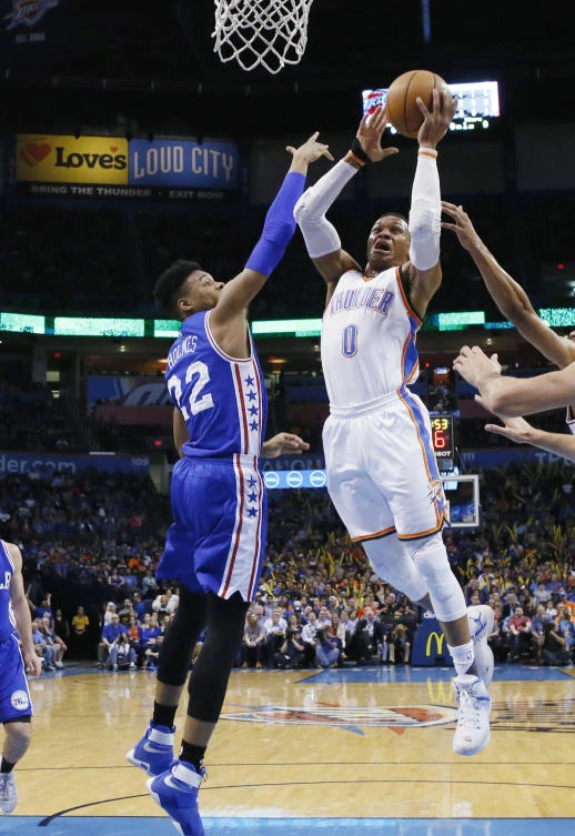 Oklahoma City Thunder guard Russell Westbrook (0) shoots in front of Philadelphia 76ers forward Richaun Holmes (22) during the first quarter of an NBA basketball game in Oklahoma City on Wednesday night. (AP)