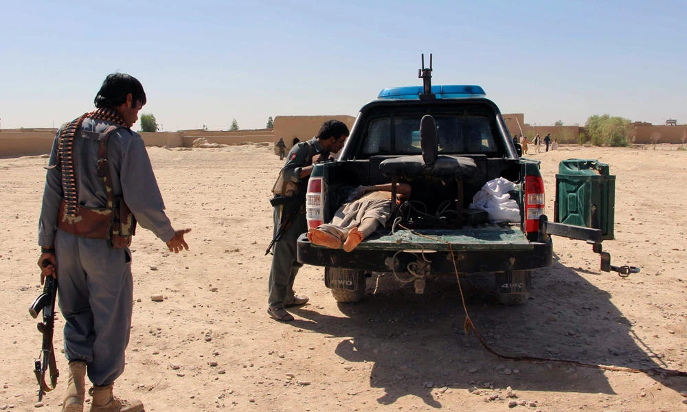 A dead Taliban militant is loaded on a vehicle after a clash with Afghan police forces in Lashkar Gah, capital of Helmand province, on October 10, 2016. Taliban militants on Thursday captured a key district in Helmand, officials said. (REUTERS file photo)