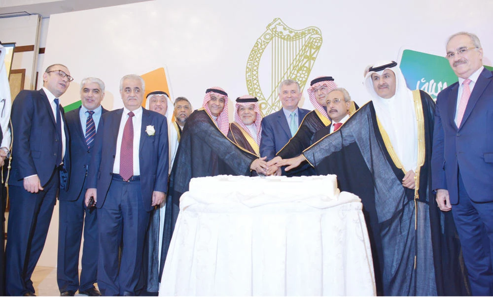 Irish Ambassador Tony Cotter, Honorary Consul Mohammed Naghi, guest of honor Prince Amr Mohammed Al-Faisal and Ambassador Jamal Bakr Belkhour, director general of the protocol department at the Ministry of Foreign Affairs, cut the cake on National day of Ireland in Jeddah. (Photo by Fouzia Khan)