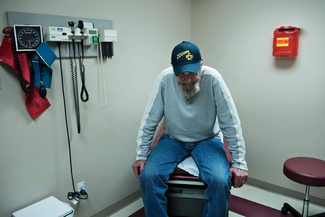 Don Humbertson, a 64 year old lung cancer surviver, waits to be examined. (AFP)