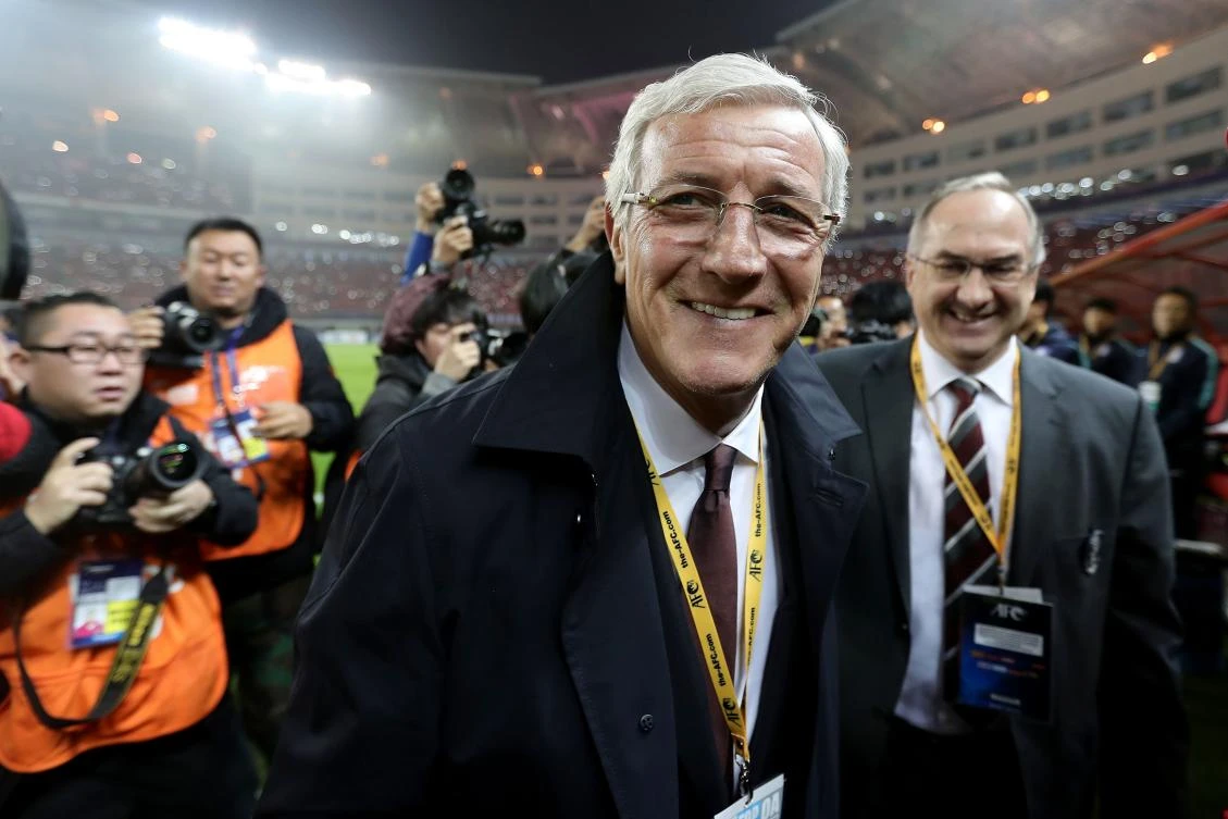 China's head coach Marcello Lippi leaves after the World Cup football qualifying match against South Korea in Changsha, China's central Hunan province on Thursday. (AFP)