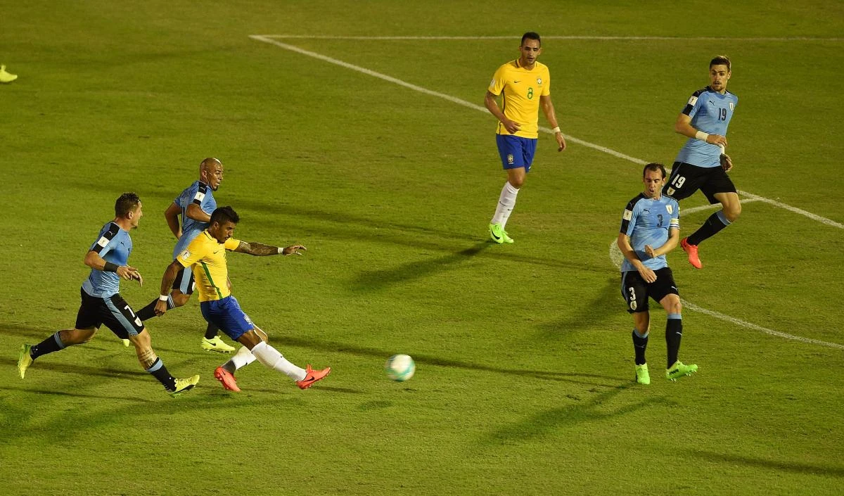 Brazil's midfielder Paulinho, second left, scores his first goal during their 2018 FIFA World Cup qualifier football match against Uruguay at the Centenario stadium in Montevideo, on Thursday night. (AFP)