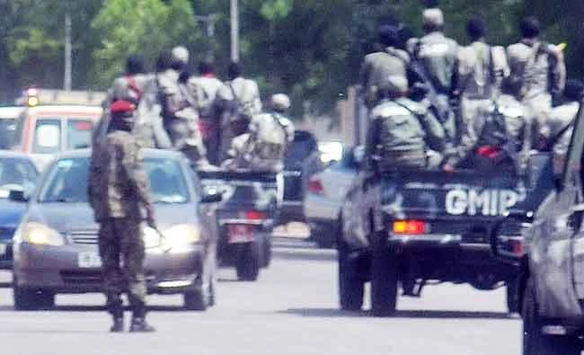 A file photo taken on June 15, 2015 shows police forces and soldiers patrolling outside the police headquarters in N'Djamena. (AFP)