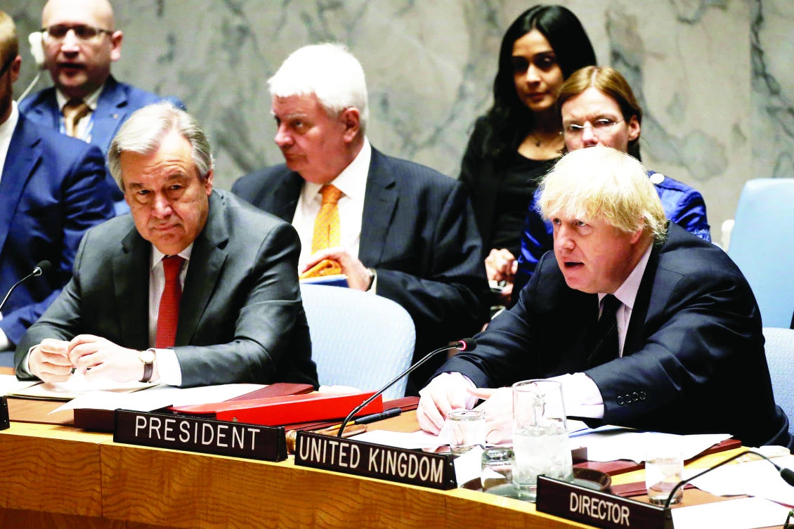 British Foreign Secretary Boris Johnson, right, sits next to UN Secretary General Antonio Guterres as Johnson chairs a UN Security Council meeting on South Sudan at the UN in New York City on Thursday. (Reuters)