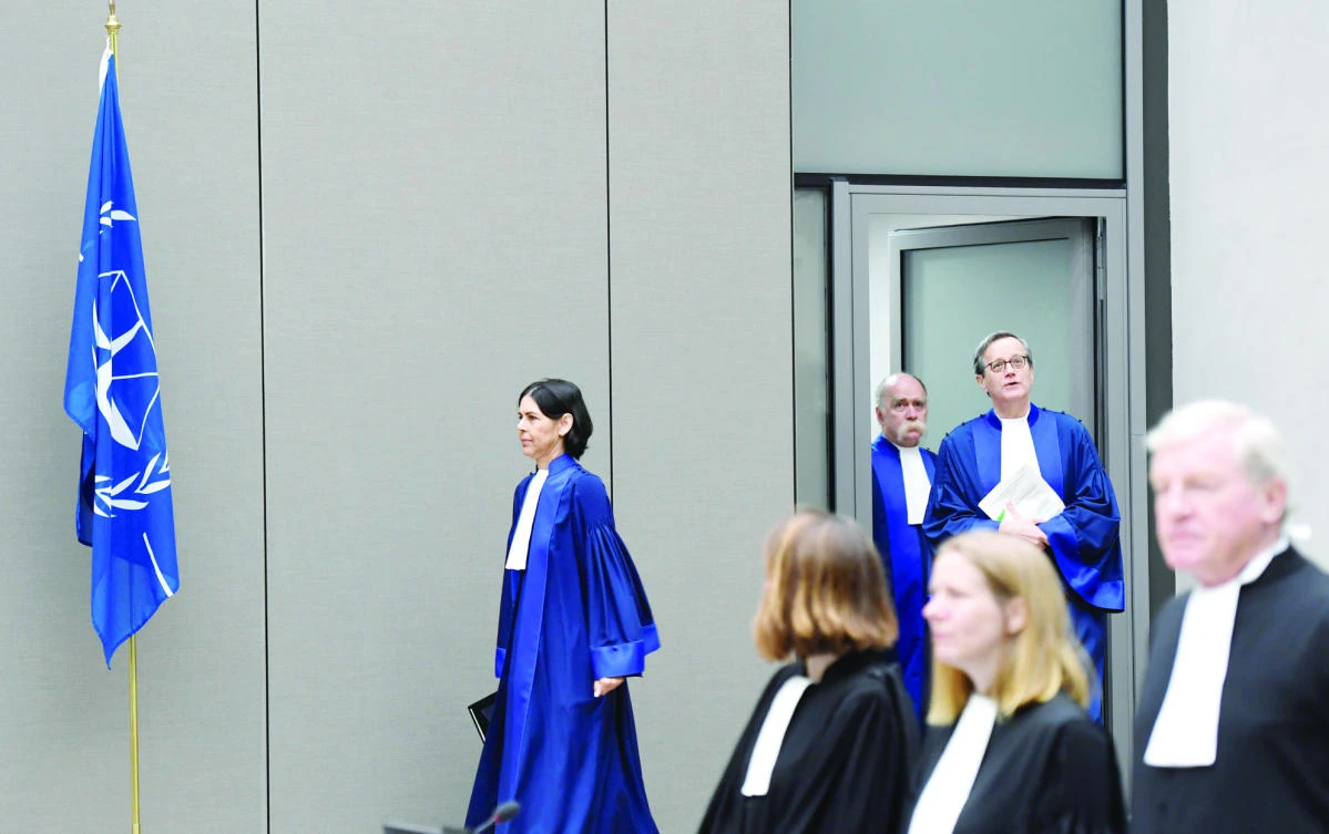 Presiding Judge Marc Perrin de Brichambaut, Judge Olga Herrera-Carbuccia, and Judge Peter Kovacs enter the courtroom of the International Criminal Court, as the ICC delivers its order for reparations to victims in the case The Prosecutor v. Germain Katanga, in The Hague, Netherlands on Friday. (Reuters)