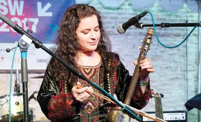 Iraqi-American Dena El Saffar performs at a music concert in Austin, Texas. (AFP)