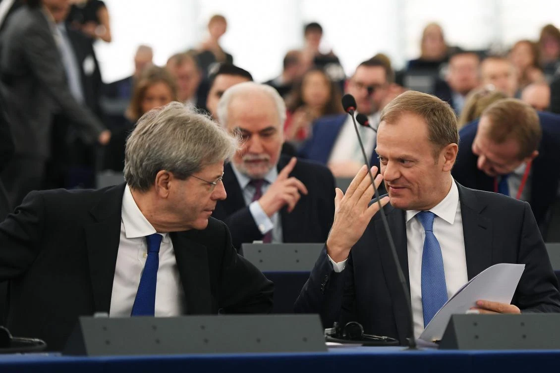 European Council President Donald Tusk (R) speaks with Italy's Prime Minister Paolo Gentiloni. (AFP)