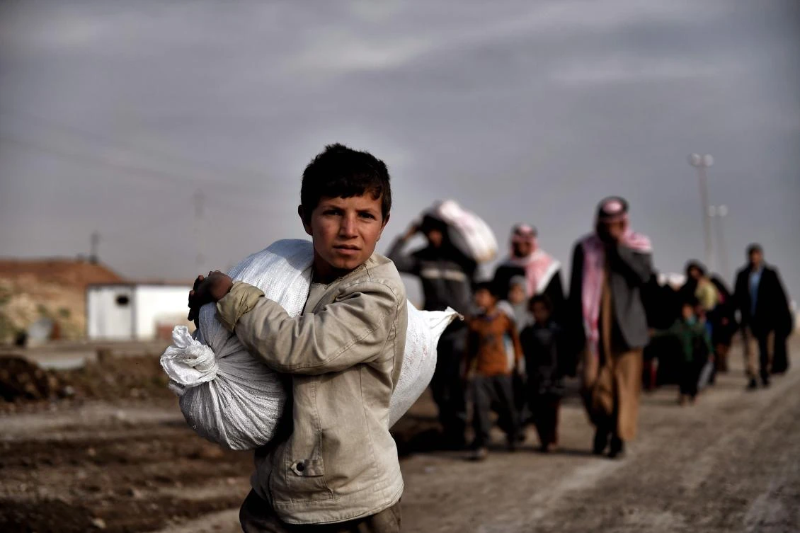 Displaced residents of western Mosul evacuate the area. (AFP)