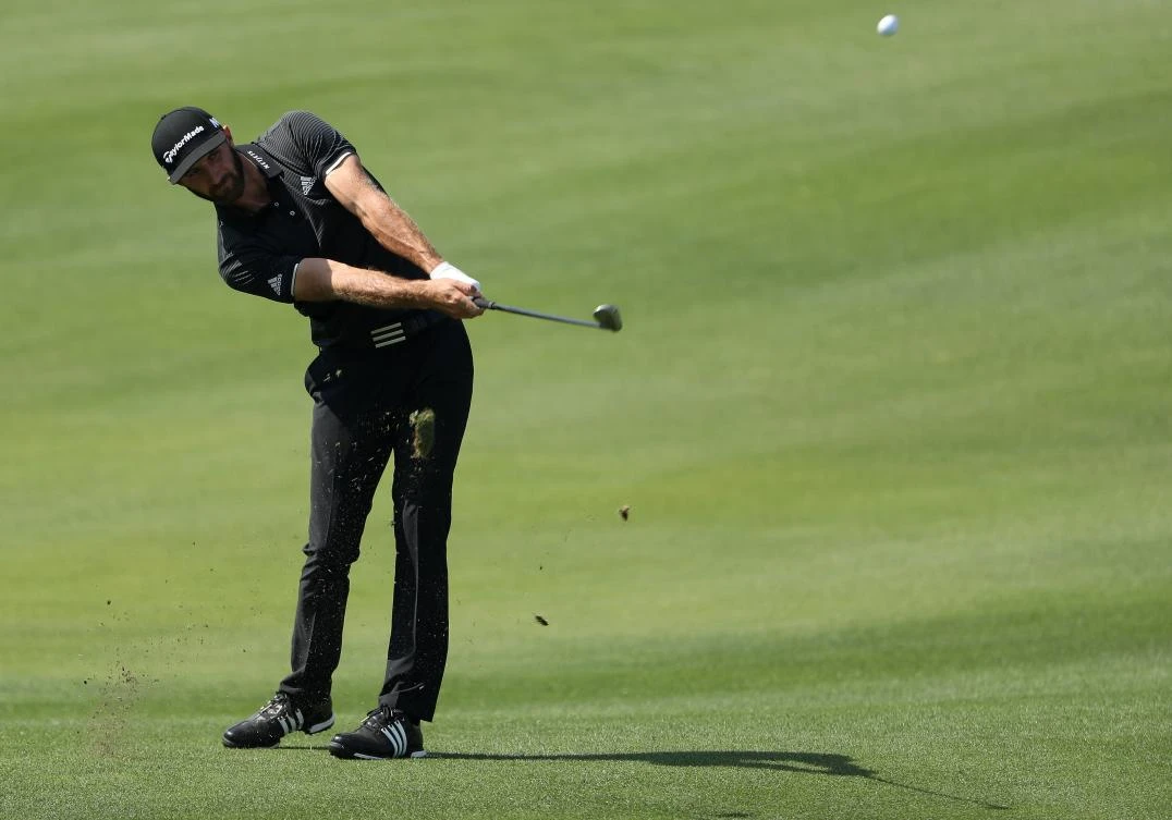 Dustin Johnson plays a shot on the 13th hole of his match during round three of the World Golf Championships-Dell Technologies Match Play at the Austin Country Club on Friday in Austin, Texas. (AFP)