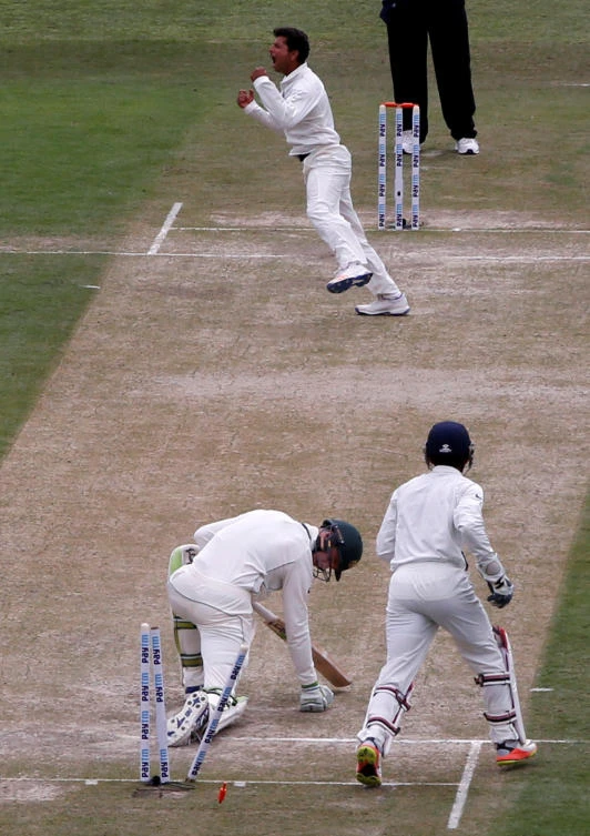 India's Kuldeep Yadav celebrates after dismissing Australia's Peter Handscomb on Saturday during the India vs. Australia fourth Test cricket match at Himachal Pradesh Cricket Association Stadium in Dharamsala, India. (Reuters)