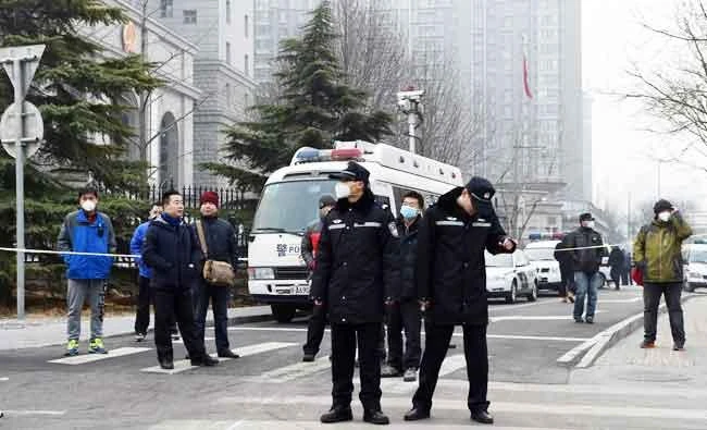 Police stand guard outside the No. 2 Intermediate People's Court where human rights lawyer Pu Zhiqiang was being sentenced in Beijing, in this December 22, 2015 file photo. (AFP)