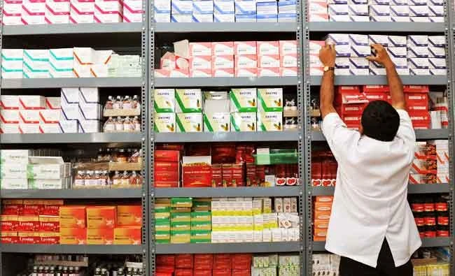 In this photo taken on June 28, 2012, an Indian pharmacist pulls out a box of medicines from a shelf at a generic drug store at the Victoria Hospital in Bangalore. (AFP)