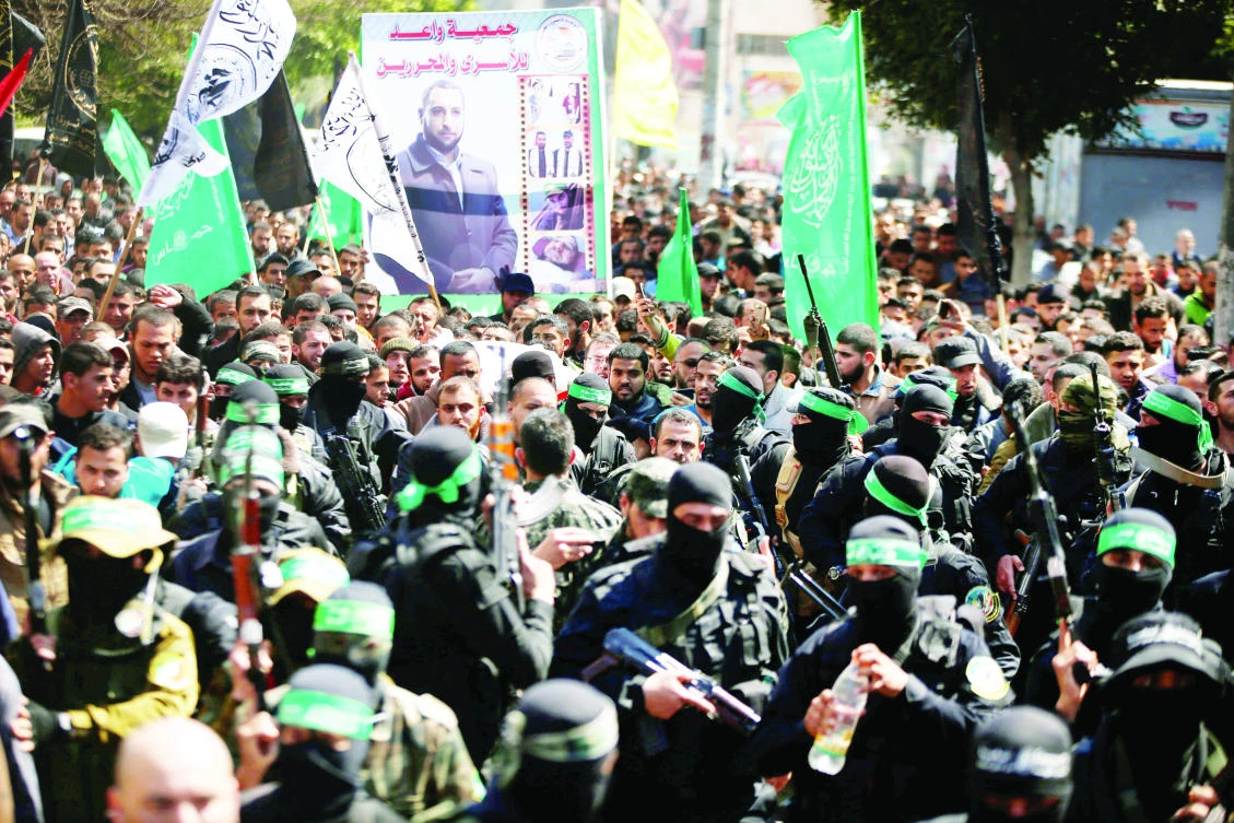 Palestinians attend the funeral of Mazen Fuqaha, a senior Hamas member, in Gaza City on Saturday. (Reuters)