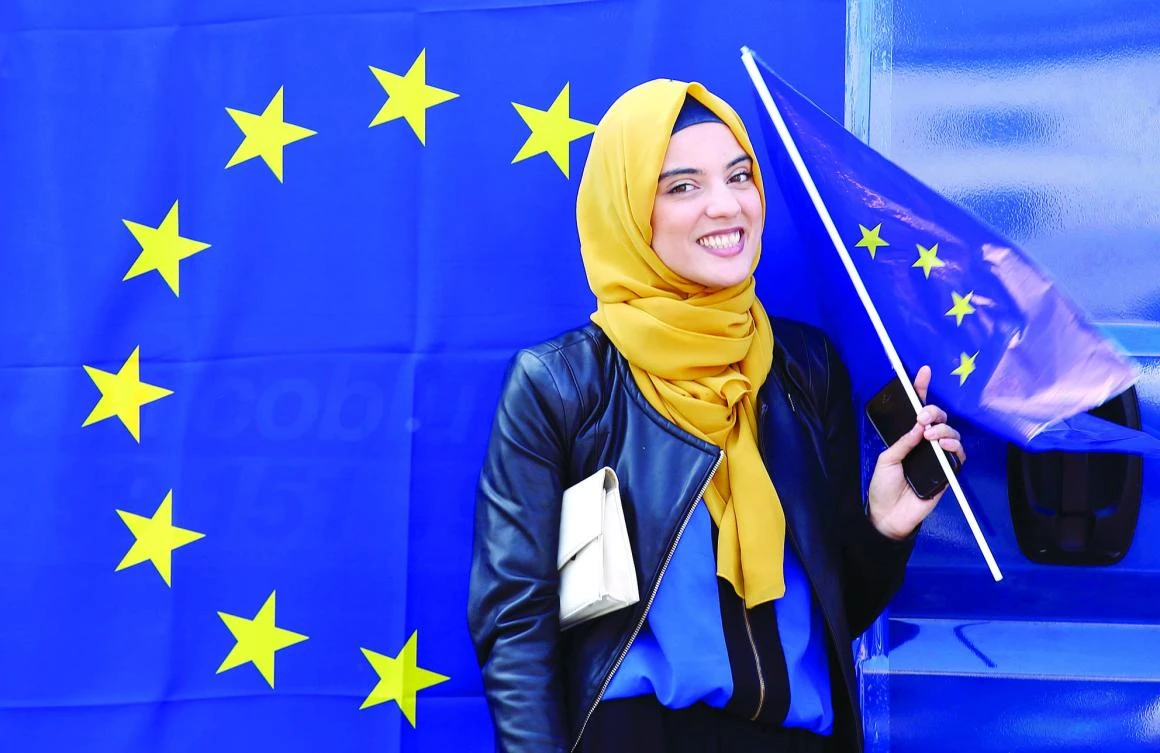 A woman holds an European flag during a pro-EU demonstration as EU leaders meet on the 60th anniversary of the Treaty of Rome,
in Rome, Italy, on Saturday. (Reuters)