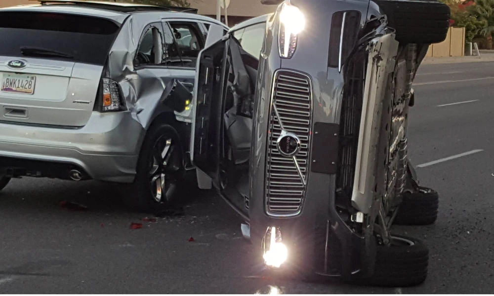 A self-driven Volvo SUV owned and operated by Uber Technologies Inc. is flipped on its side after a collision in Tempe, Arizona, on March 24, 2017.(Courtesy Fresco News/Mark Beach/Handout via Reuters)