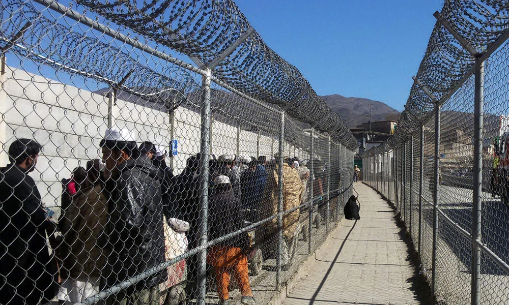 This photo taken on February 9, 2017 shows Afghan nationals waiting to cross the border between Pakistan and Afghanistan at the Torkham Border Post in Pakistan's Khyber Agency. Pakistan on Sunday said it has started building a fence along the Afghan border in areas where it says militants have launched cross-border attacks on security posts in recent weeks. (AFP)