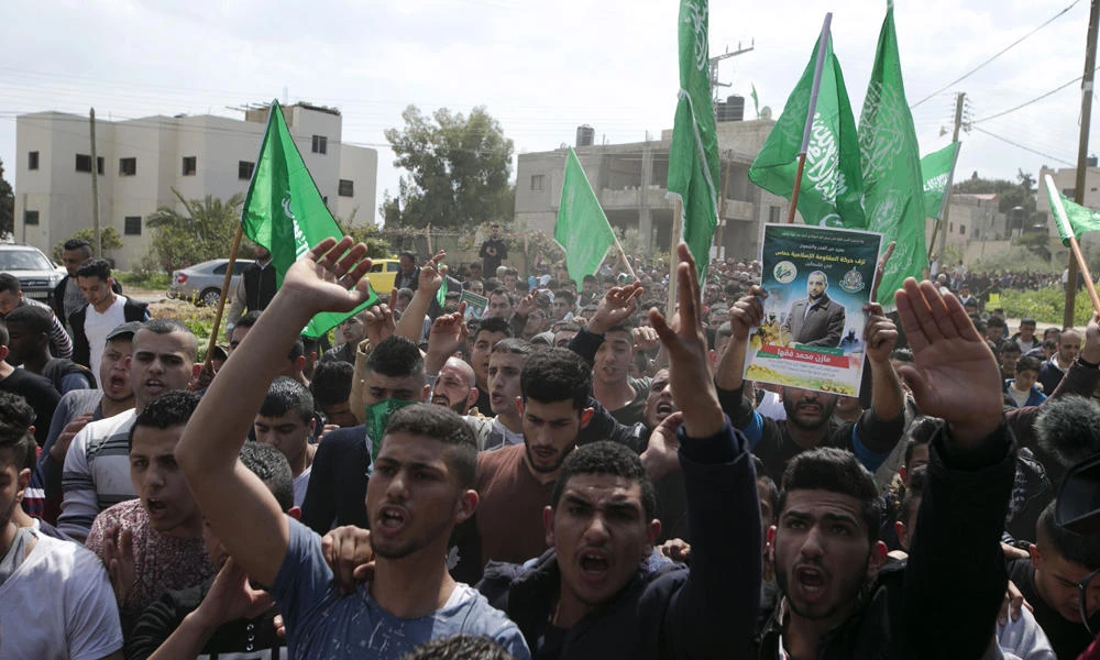 Palestinian supporters of Mazen Faqha, who was shot dead by unknown gunmen in the Gaza Strip a day earlier, march during a demonstration in the West Bank village of Tubas on Saturday. (AFP / JAAFAR ASHTIYEH)