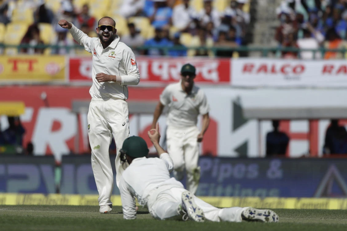 Australia's Nathan Lyon celebrates the dismissal of India's Cheteshwar Pujara during the second day of their fourth Test cricket match in Dharmsala, India, Sunday. (AP)