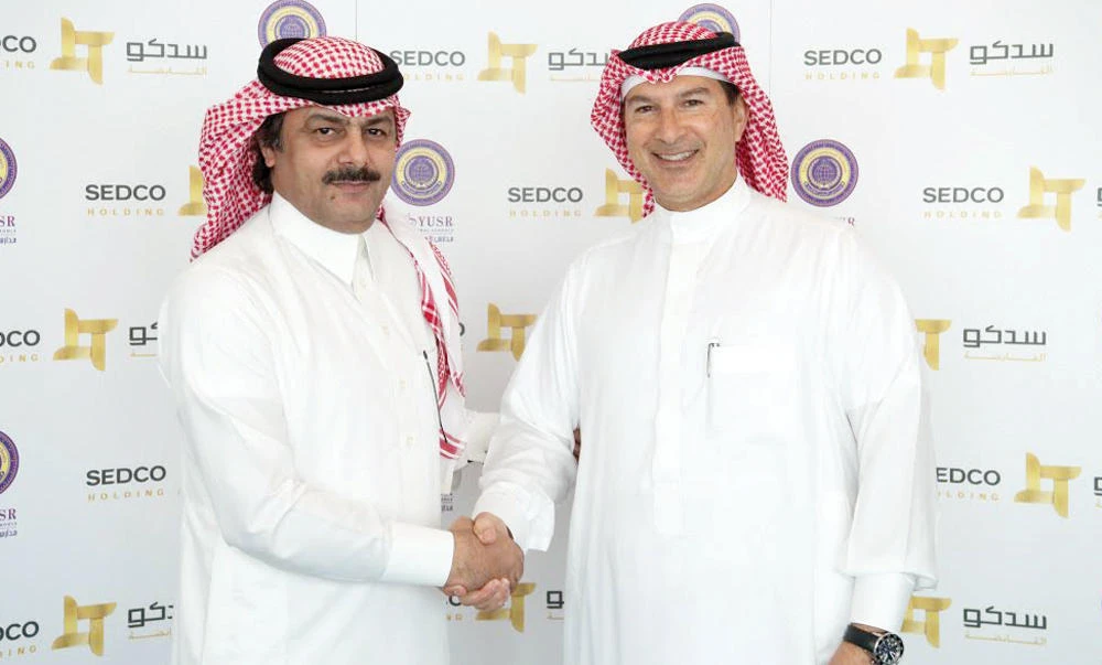 Anees Ahmad Moumina, CEO, SEDCO Holding Group, right, and Zamil Al-Otaibi, CEO, Yusr Holding Group, at the event in Jeddah.