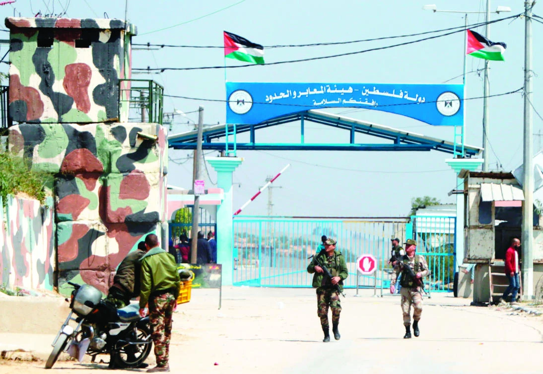 Hamas security forces stand guard at Erez border crossing into Israel, in Beit Hanun, in the northern Gaza Strip on Sunday, after it was closed by Hamas after blaming Israel for the assassination of one of its officials in Palestine. (AFP)