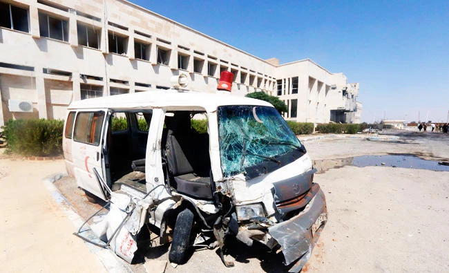 A damaged ambulance is parked in front of the National Hospital of al-Tabaqa, after what activists said was an air strike by forces of Syria's President Bashar Al-Assad on the hospital, beside al-Tabqa military base, west of Raqqa, in this August 23, 2014 file photo. (Reuters)