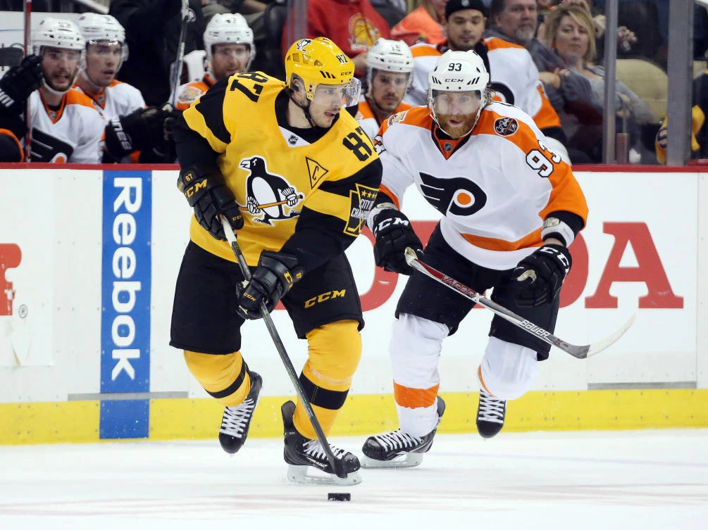 Pittsburgh Penguins center Sidney Crosby (87) skates with the puck as Philadelphia Flyers right wing Jakub Voracek (93) defends during the third period at the PPG PAINTS Arena on Sunday night. (USA TODAY Sports)