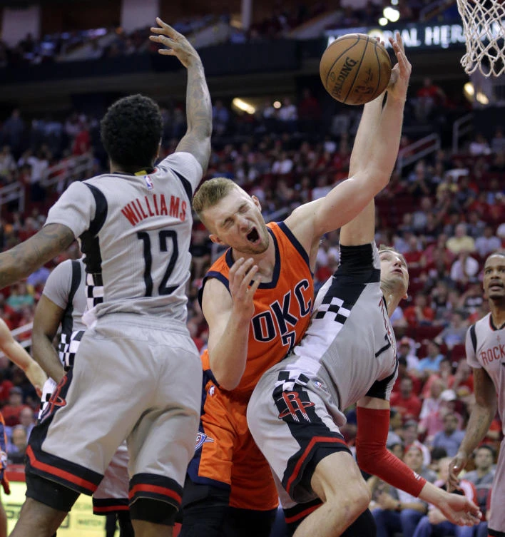 Oklahoma City Thunder's Domantas Sabonis (3) battles for a rebound with Houston Rockets' Lou Williams (12) and Sam Dekker (7) in the first half of their NBA game in Houston on Sunday. (AP)