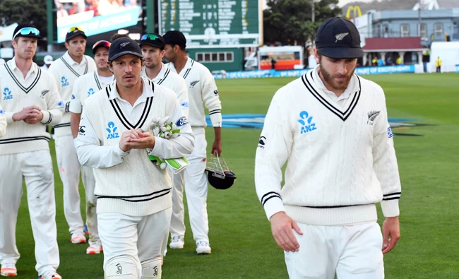 New Zealand's captain Kane Williamson leads his team off the field. (AP)