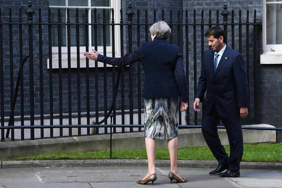 Britain’s Prime Minster Theresa May greets Qatar’s Prime Minister Abdullah bin Nasser bin Khalifa Al Thani outside of 10 Downing Street in central London. (AFP)