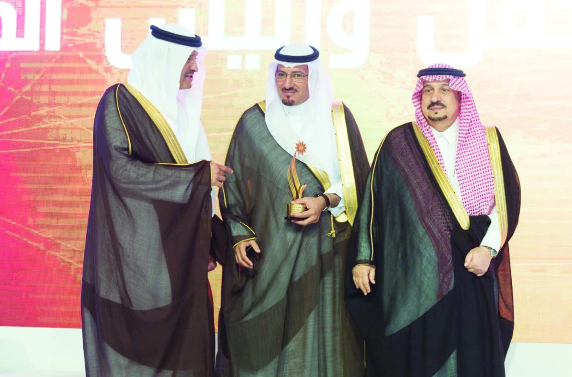 Prince Faisal bin Bandar is joined by Prince Sultan bin Salman, president of the Saudi Commission for Tourism and National Heritage (SCTH), at the Tourism Excellence awards, in Riyadh on Sunday. (SPA)