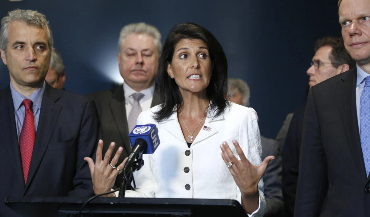 United States Ambassador to the United Nations Nikki Haley, center, speaks to reporters outside the General Assembly at UN headquarters. (AP Photo)