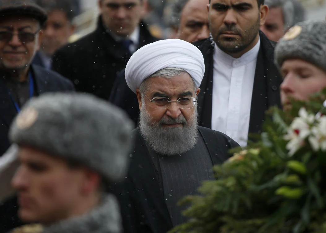 Iranian President Hassan Rouhani, center, attends a wreath laying ceremony at the Tomb of the Unknown Soldier by the Kremlin wall in Moscow, Russia.(AP)