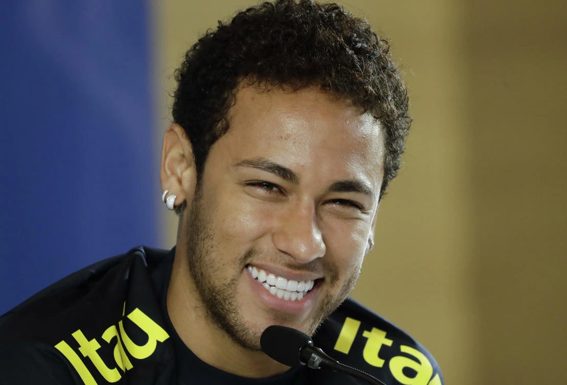 Brazil's Neymar smiles during a press conference after a training session in Sao Paulo, Brazil, Monday. (AP)