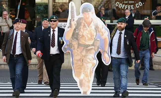 Supporters of jailed former British soldier Alexander Blackman, Marine A, arrive at The Royal Courts of Justice in London on Tuesday, to attend the result of his sentence. (AFP)