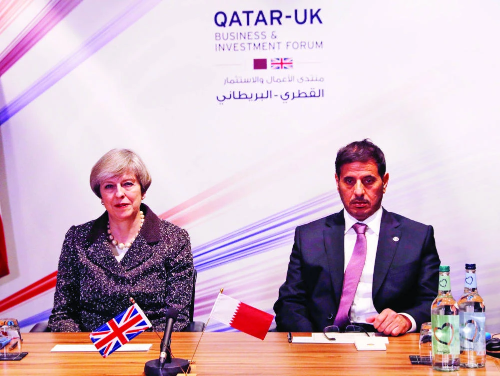 Britain’s Prime Minister Theresa May and Qatar’s Prime Minister Abdullah bin Nasser bin Khalifa Al-Thani attend the Qatar-UK Business and Investment Forum in Birmingham on Tuesday. (Reuters)