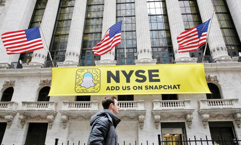 A Snapchat sign hangs on the facade of the New York Stock Exchange building. (Reuters file photo)