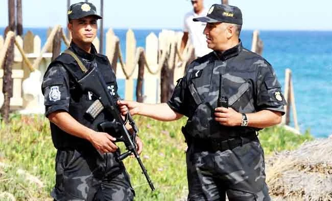 Tunisian policemen stand guard at a beach in the coastal resort of Hammamet, south-east of Tunis, in this file photo. (AFP)