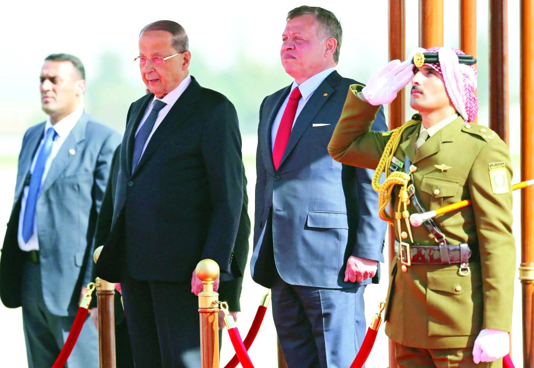 Jordan’s King Abdallah and Lebanese President Michel Aoun listen to their national anthems during a welcome ceremony at the airport in Amman on Tuesday. (AFP)