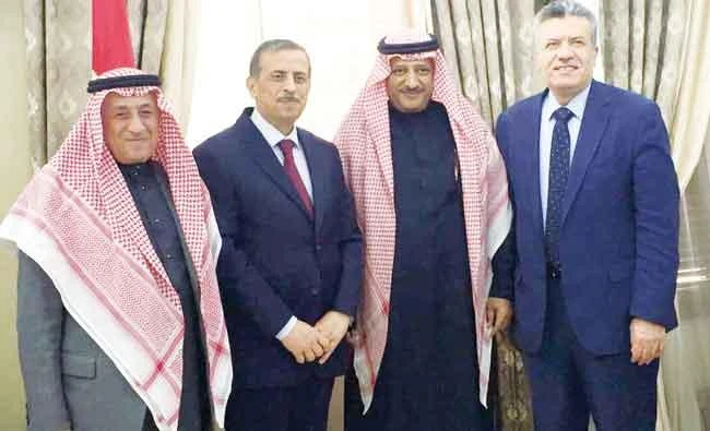 Khaled Al-Jawhar, second right, with Dr. Fawzi Al-Hammouri, second left, following the signing of the agreement in Amman on Tuesday. (AN photo)