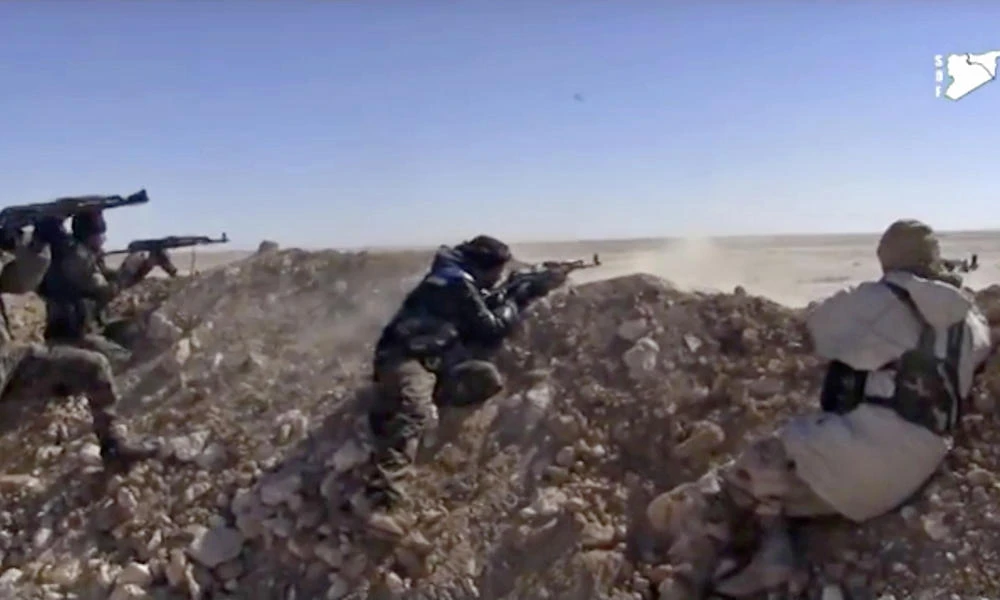 This frame grab from a March 6, 2017 video provided by the Syria Democratic Forces (SDF) shows fighters from the SDF opening fire on a position of the Daesh group in the countryside east of Raqqa, Syria. (Syria Democratic Forces, via AP, File)