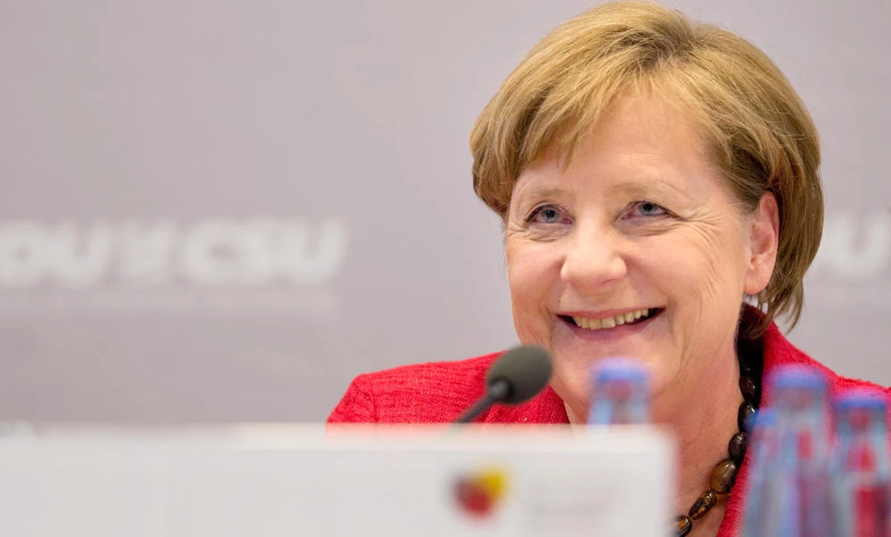 German Chancellor Angela Merkel speaks at a congress of the parliamentary groups of the christian democratic parties CDU/CSU in Berlin on Wednesday. ( AFP / dpa / Monika Skolimowska)